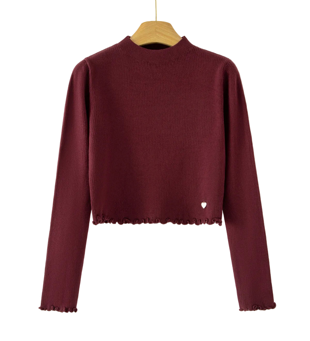 A long-sleeve ribbed knit mock-neck sweater in deep burgundy, hanging on a wooden hanger against a plain white background. The bottom hem has a scalloped edge, and a small white heart detail is visible on the lower right side.