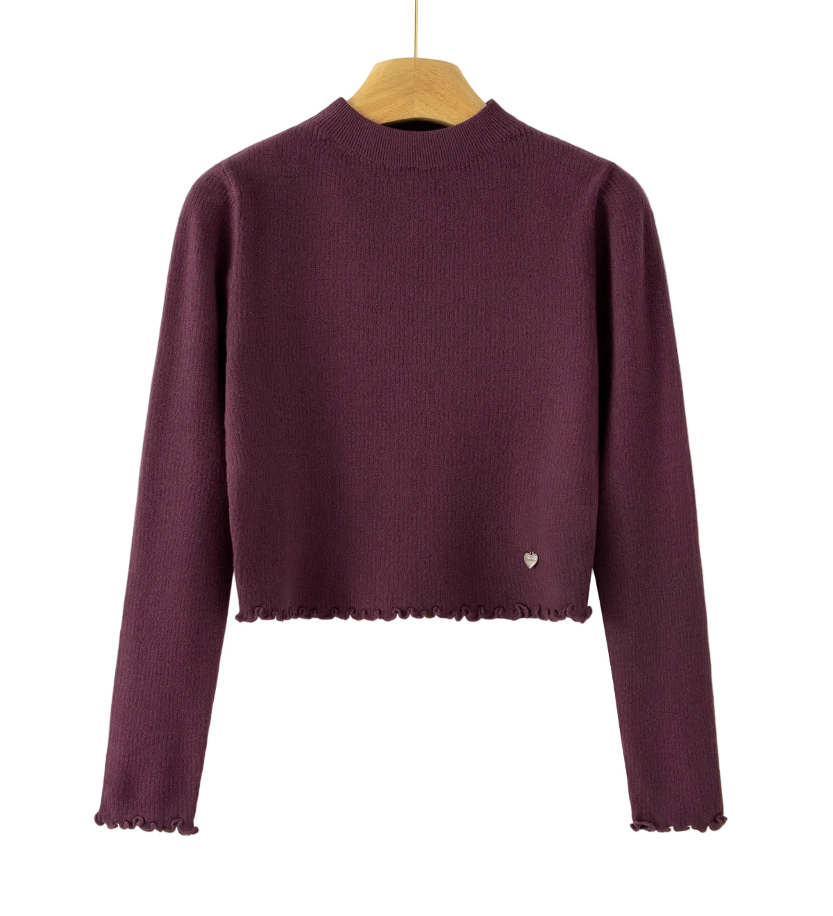 A dark plum purple ribbed knit long-sleeve crop top sweater hanging on a wooden hanger against a plain white background. The bottom hem has a scalloped edge, and there is a tiny silver heart detail on the lower left side.