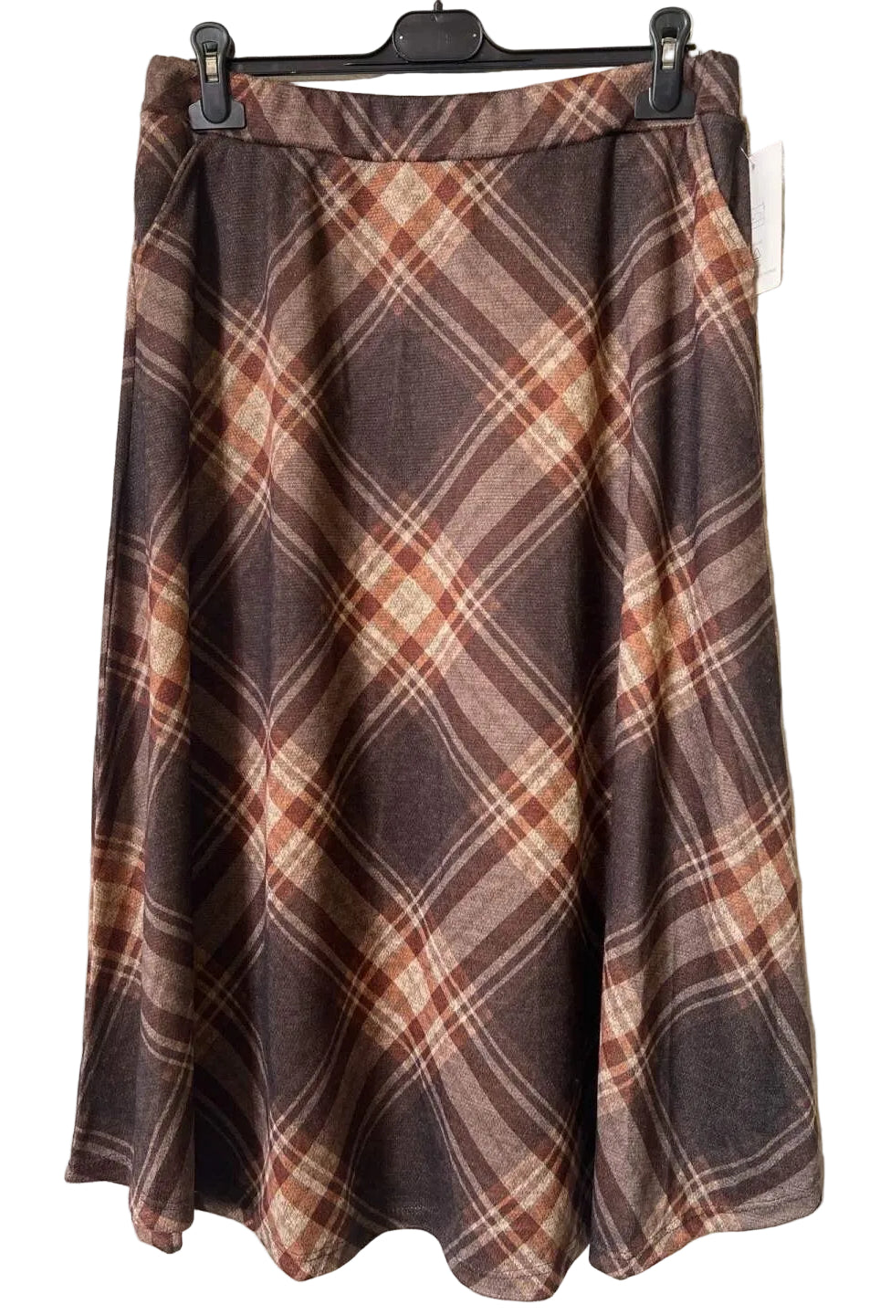 A brown plaid skirt with a warm rust-orange and beige pattern,