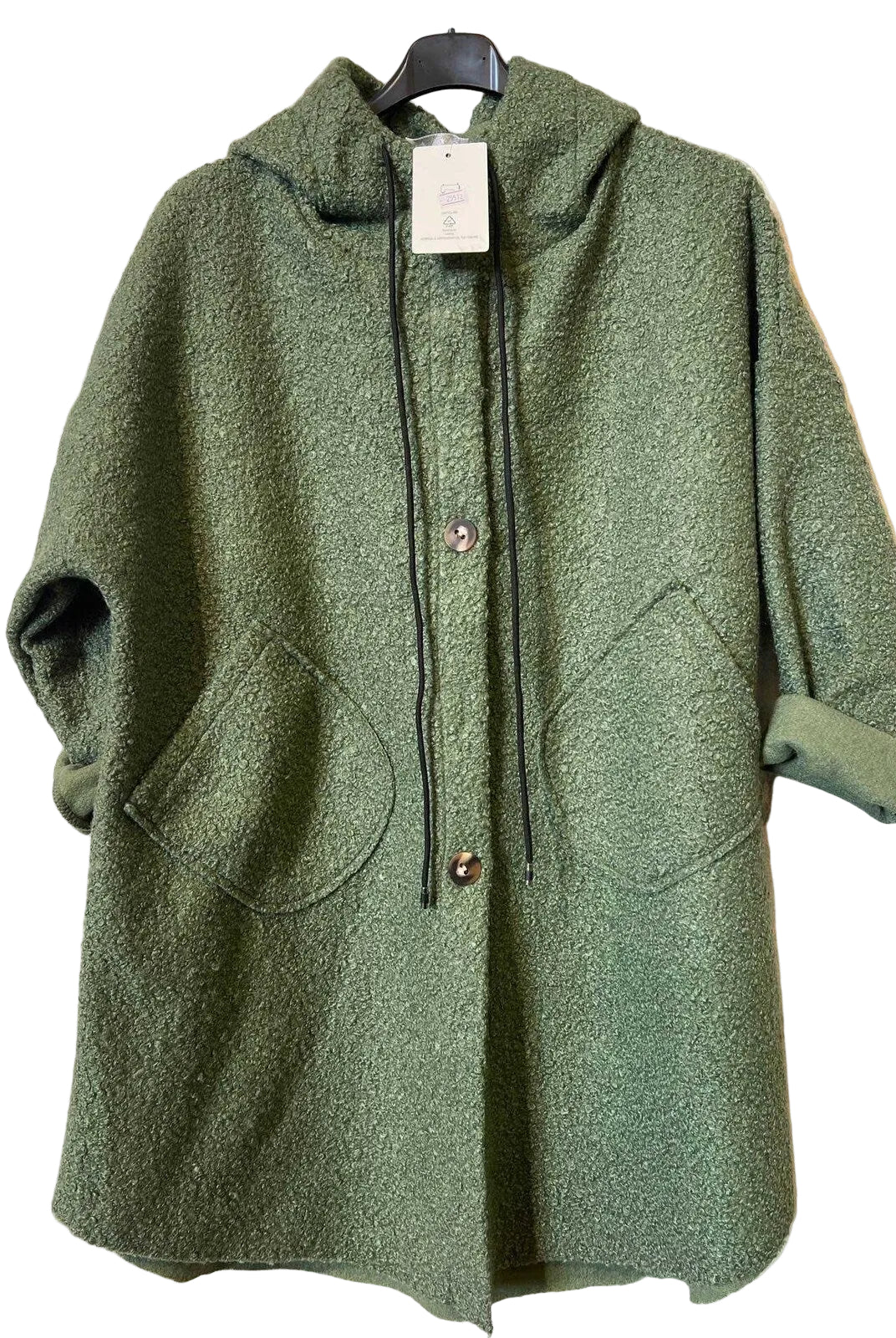 An olive green textured hooded coat with a button-front closure, large front patch pockets, and rolled cuffs, hanging on a black hanger against a light gray patterned backdrop.