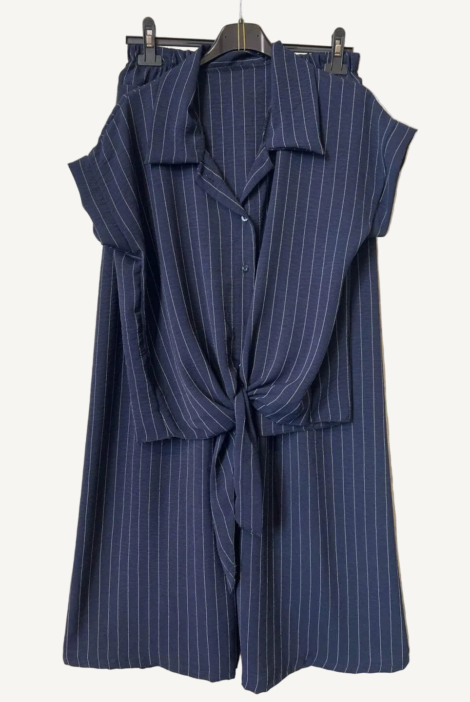 Navy stripe outfit on a hanger