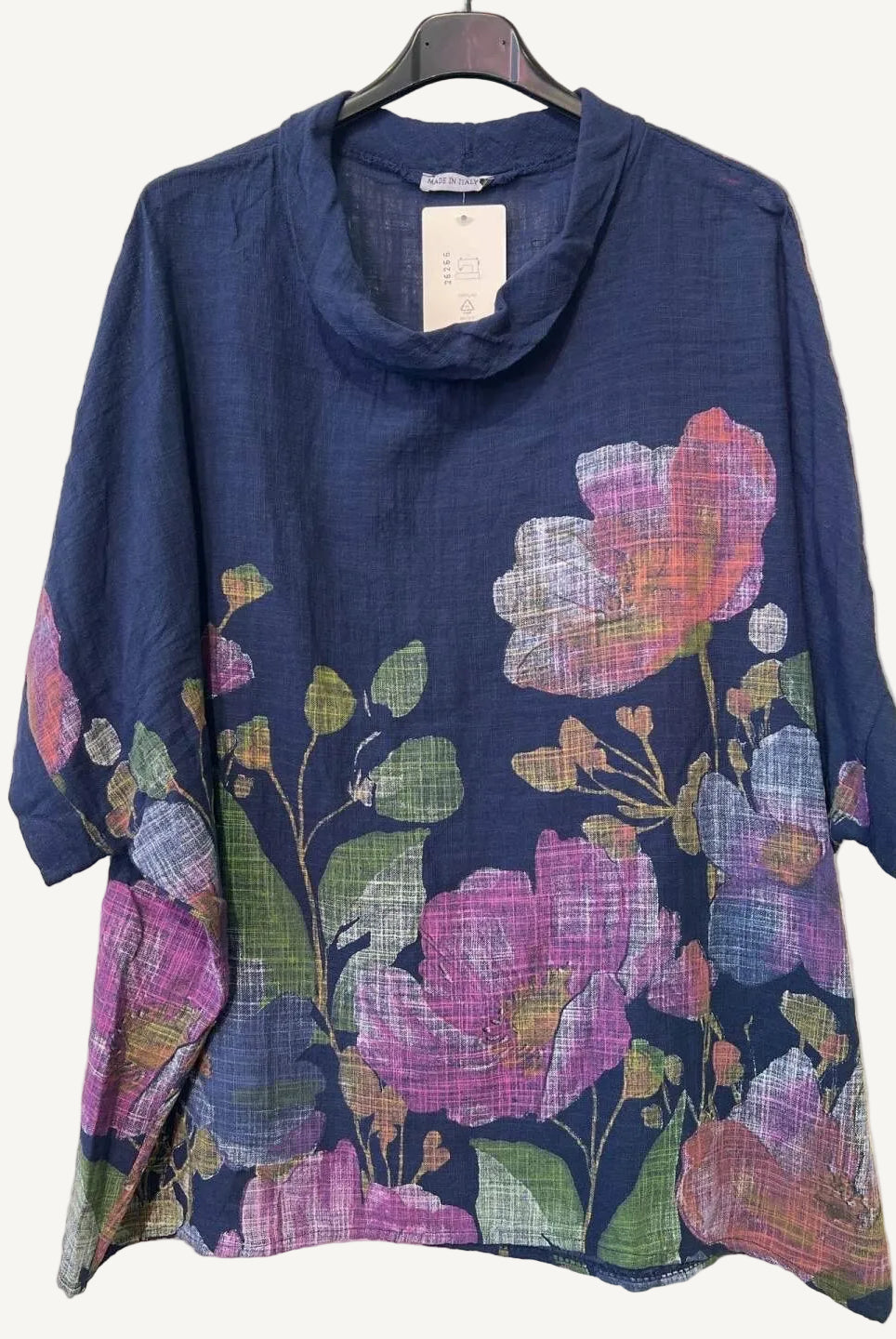 Navy blue top with colorful floral pattern on a white background