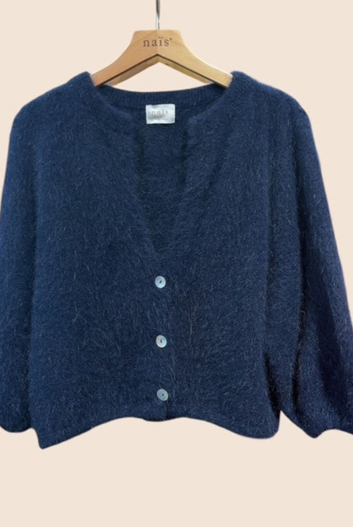 A dark navy blue angora knit cardigan sweater hanging on a wooden hanger