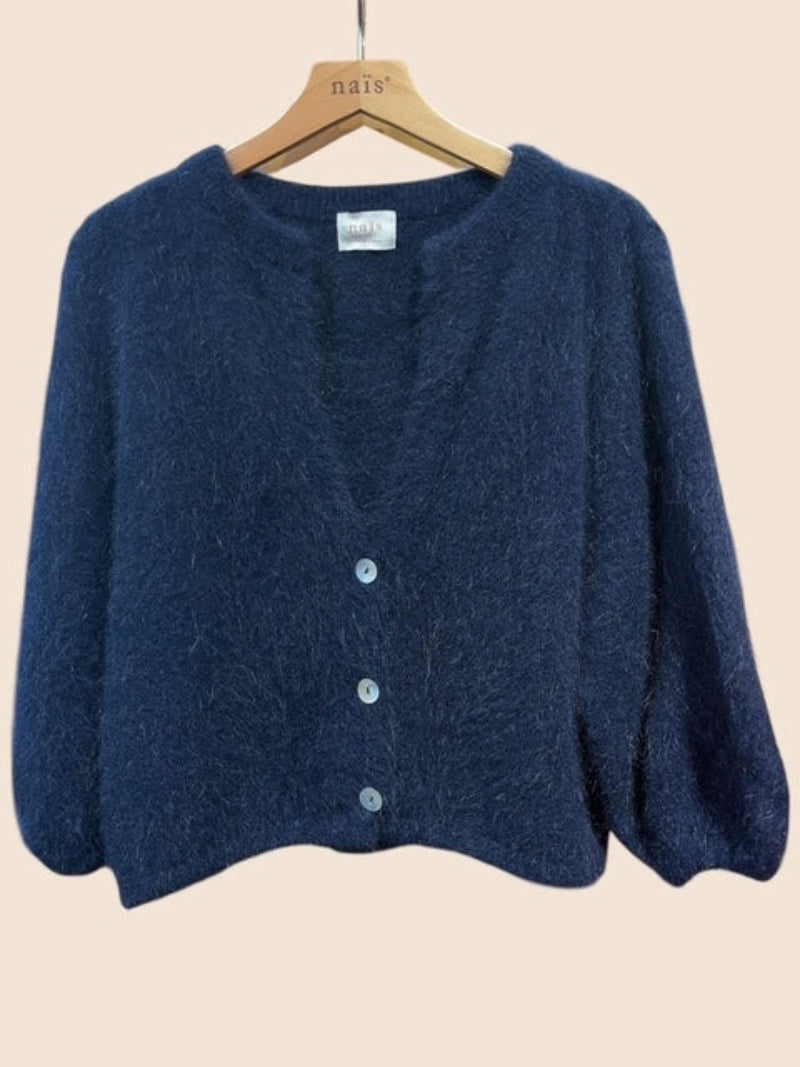 A dark navy blue angora knit cardigan sweater hanging on a wooden hanger