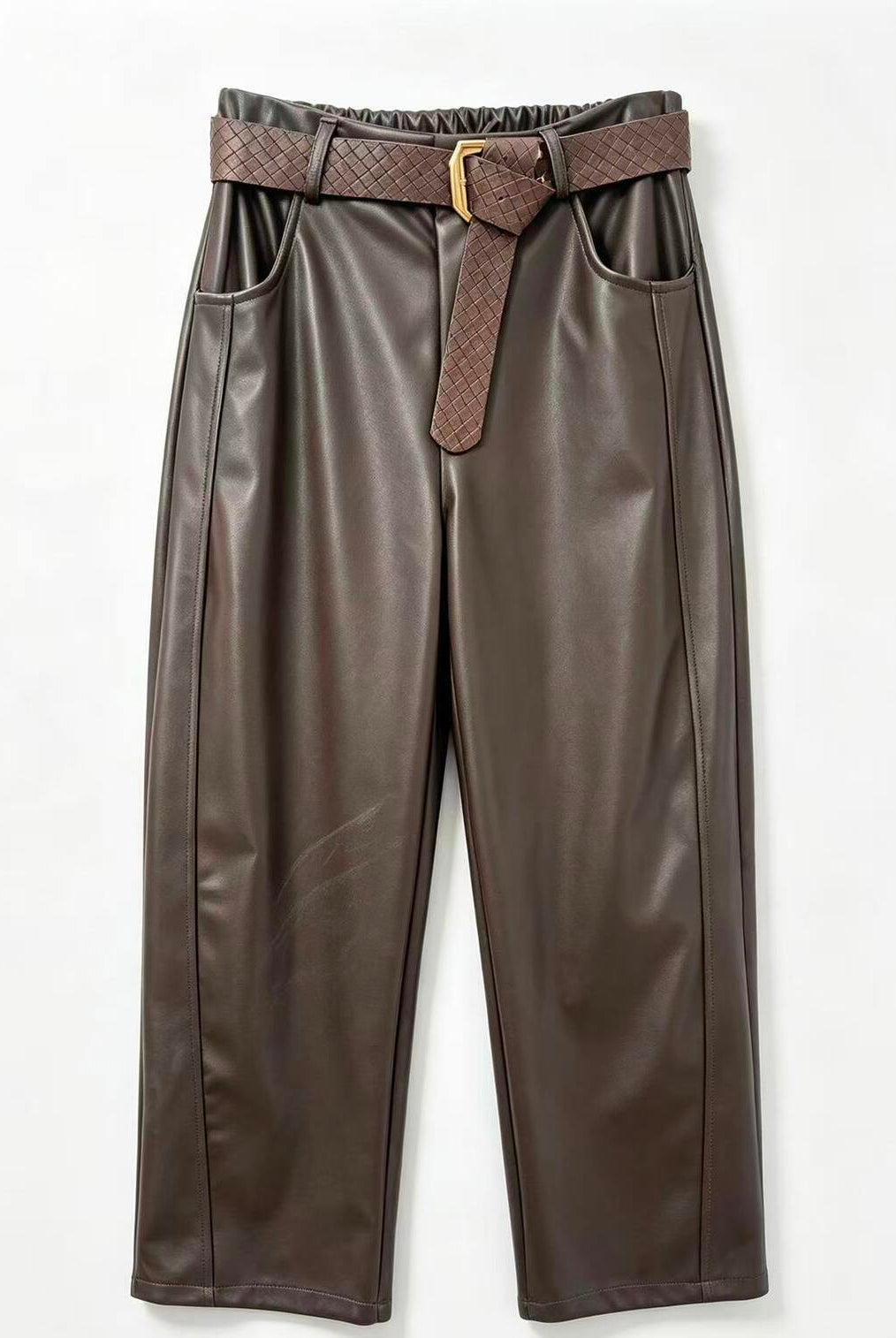 Dark brown faux leather cropped pants with a matching brown woven belt and gold buckle, displayed flat against a white background.