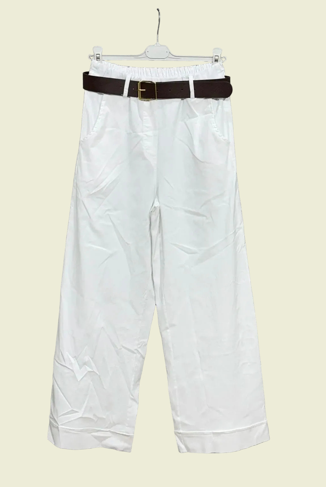 White pants with a brown belt
