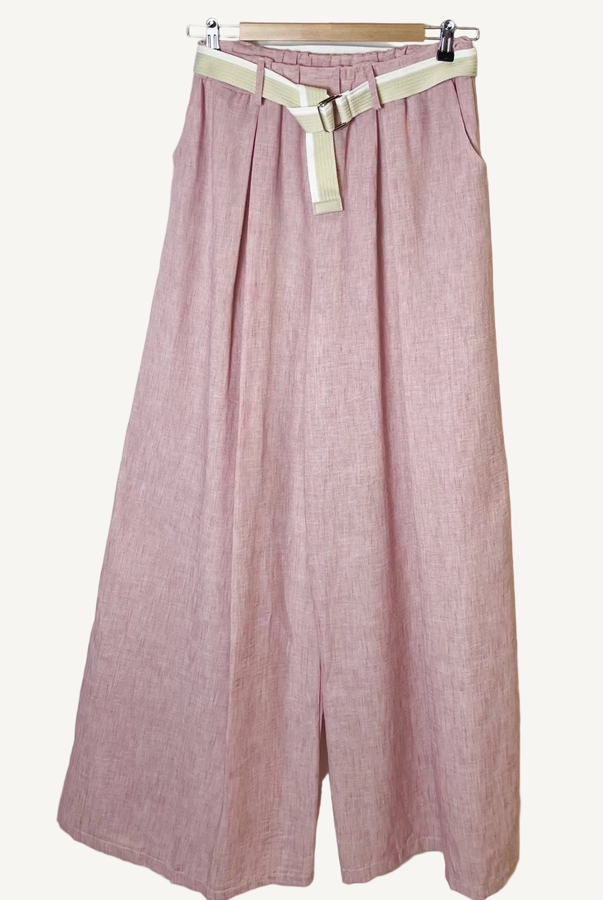 Pink pants with a belt on a white background