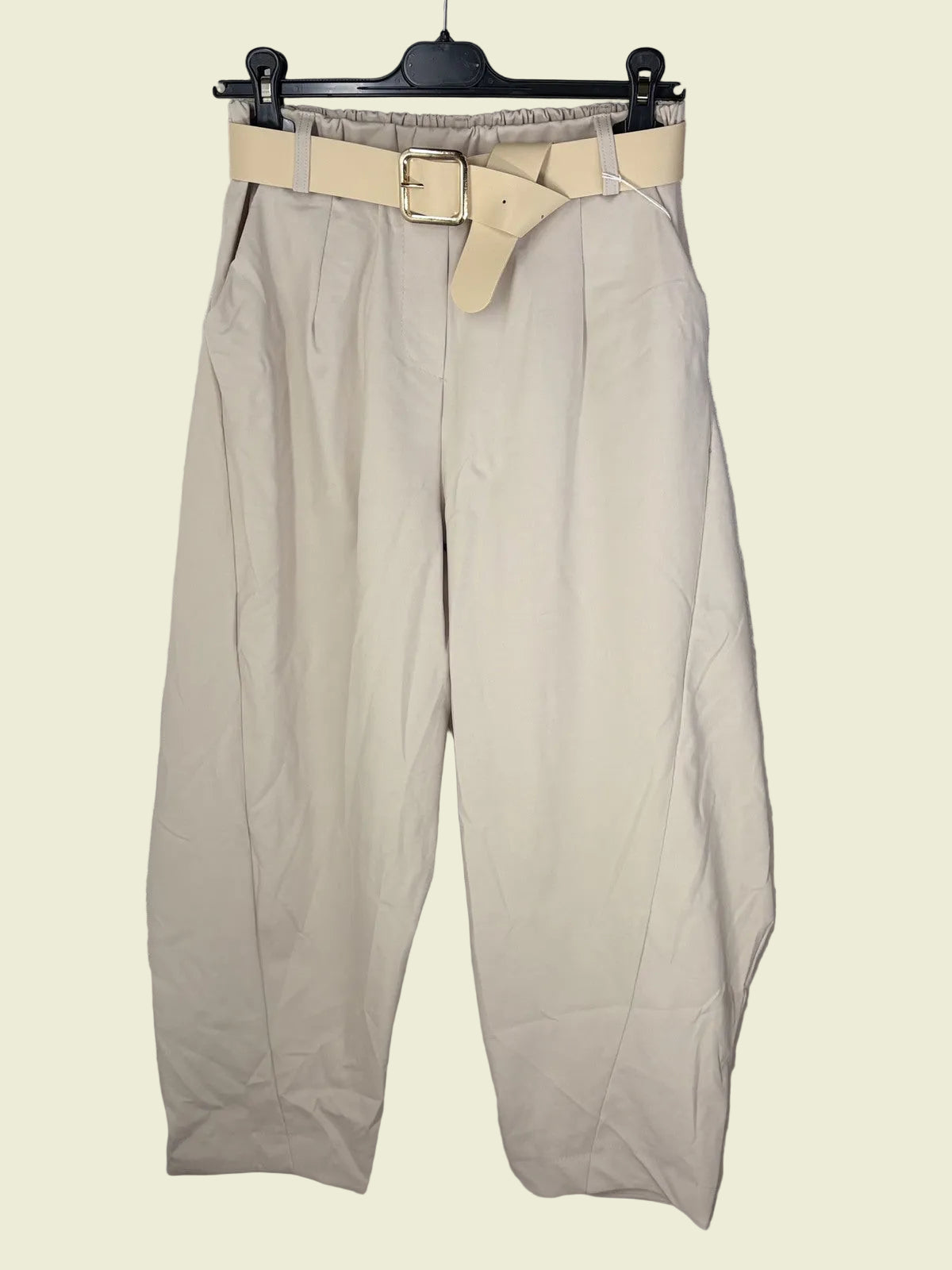 Beige pants with a belt