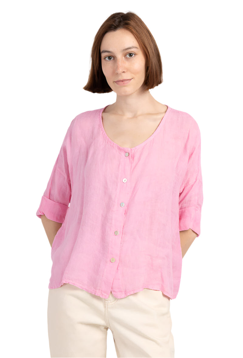 Woman wearing a pink blouse with a white background