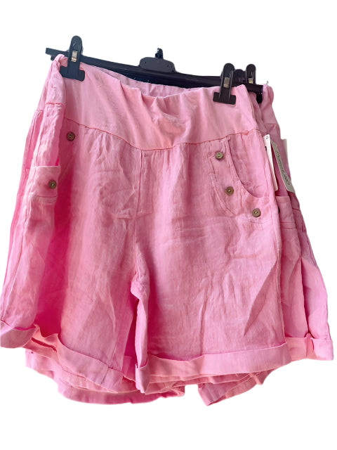 Pink short on a hanger against a white background