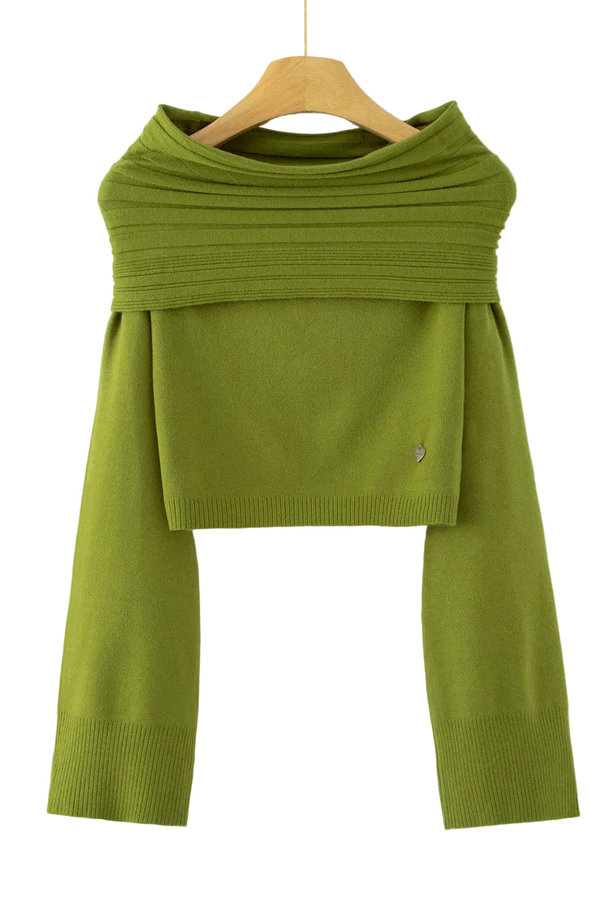 An olive green knit long-sleeve top with a wide draped yoke and cropped hem, hanging on a wooden hanger against a plain white background.