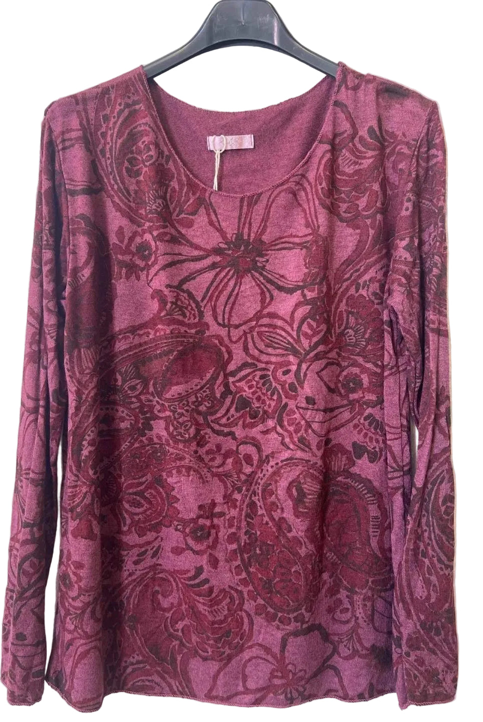 A long-sleeve scoop-neck top in a dusty rose or mauve color, featuring a dark paisley and floral jacquard pattern.