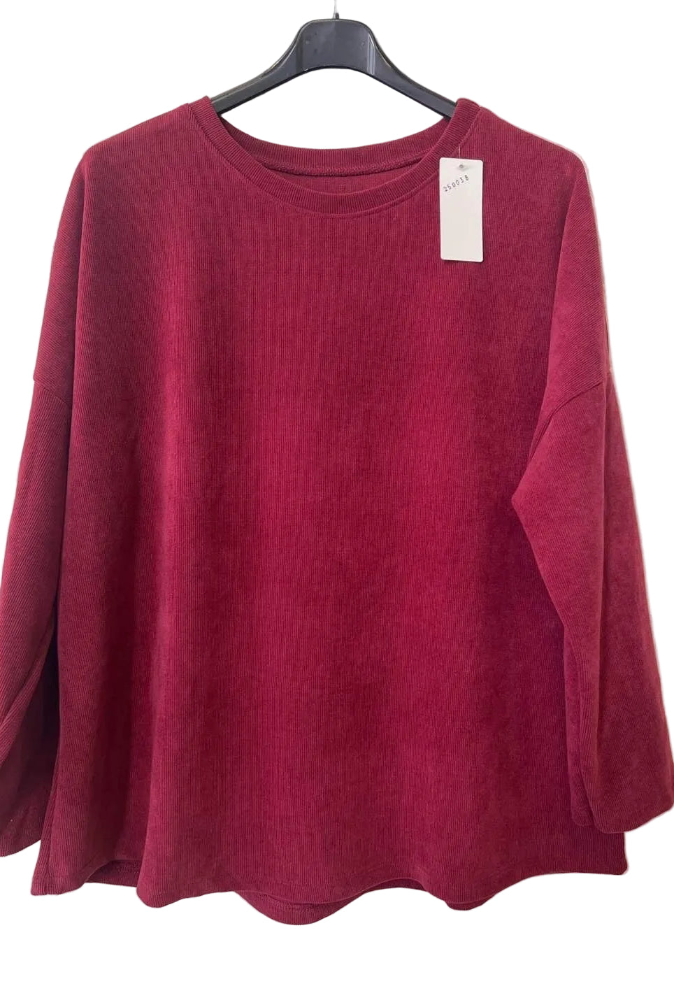 A deep burgundy long-sleeve crewneck top hanging