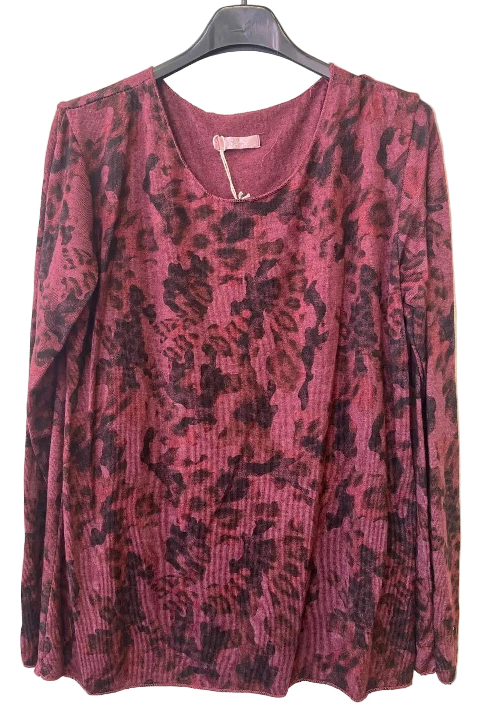 A long-sleeve scoop-neck top with a camouflage print in burgundy tones