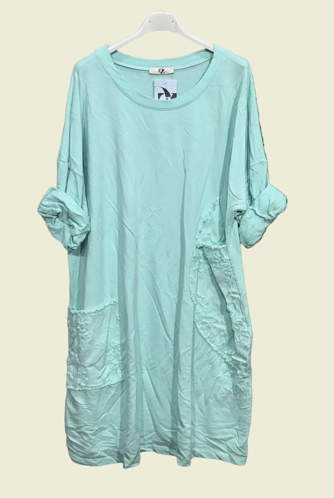 Vert D'Eau dress on a hanger