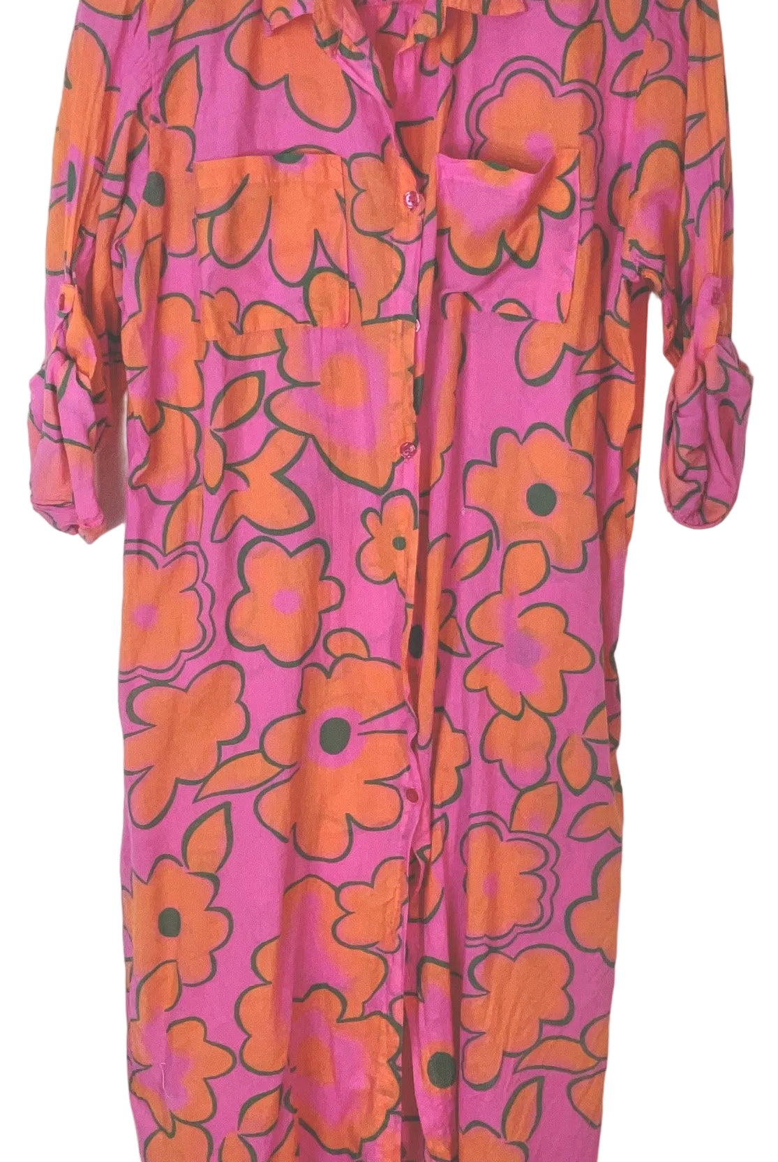 A pink and orange floral print shirt dress with a pointed collar and three-quarter sleeves, shown hanging against a plain white background.