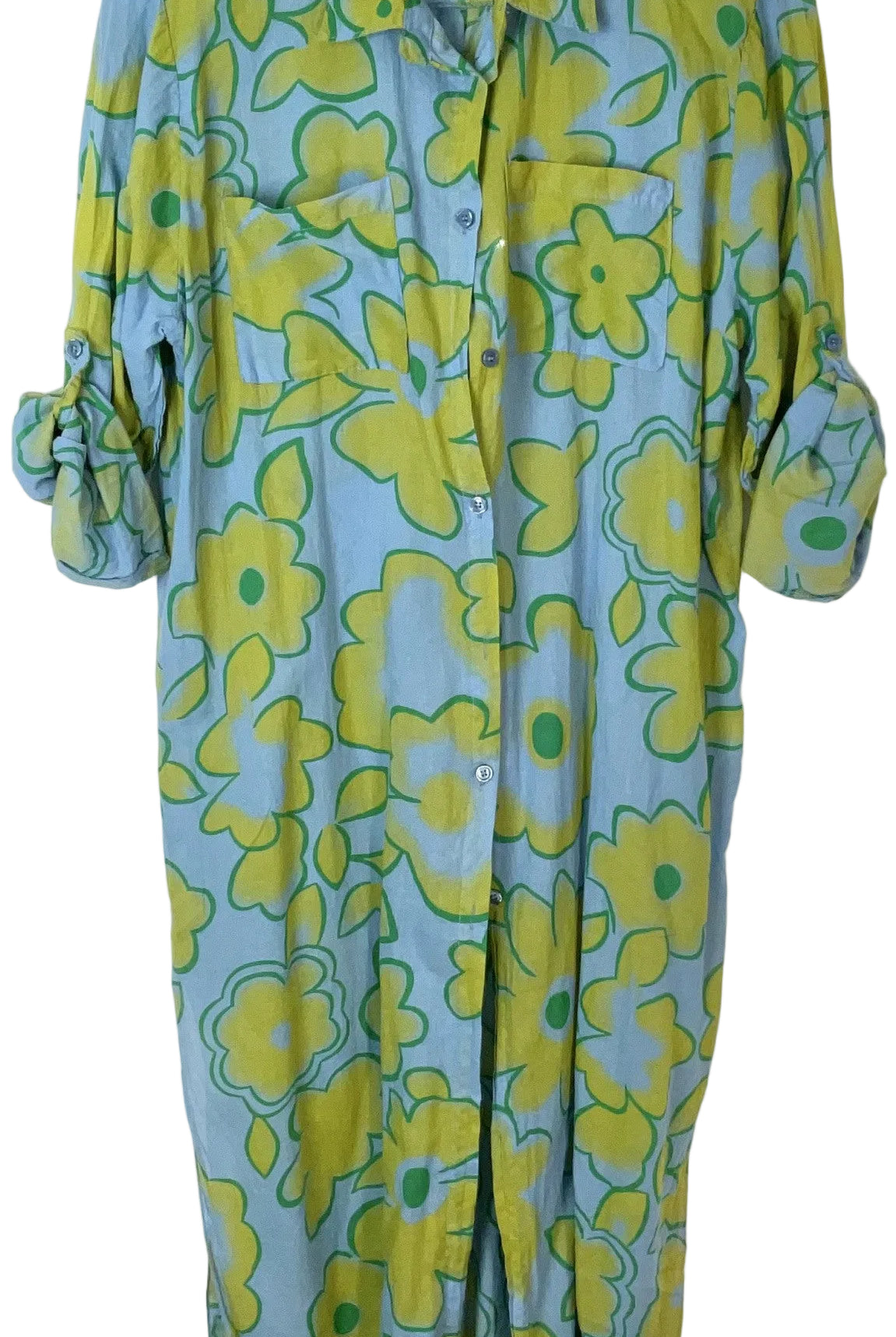 A blue button-up shirt dress with a retro floral pattern in yellow and green, featuring rolled-up sleeves and a pointed collar.