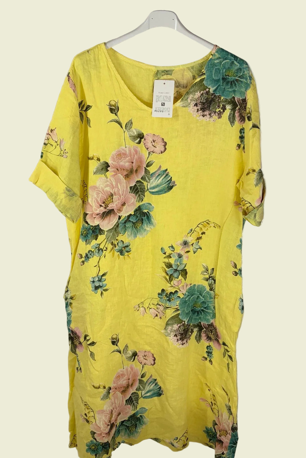 Yellow floral dress on a hanger