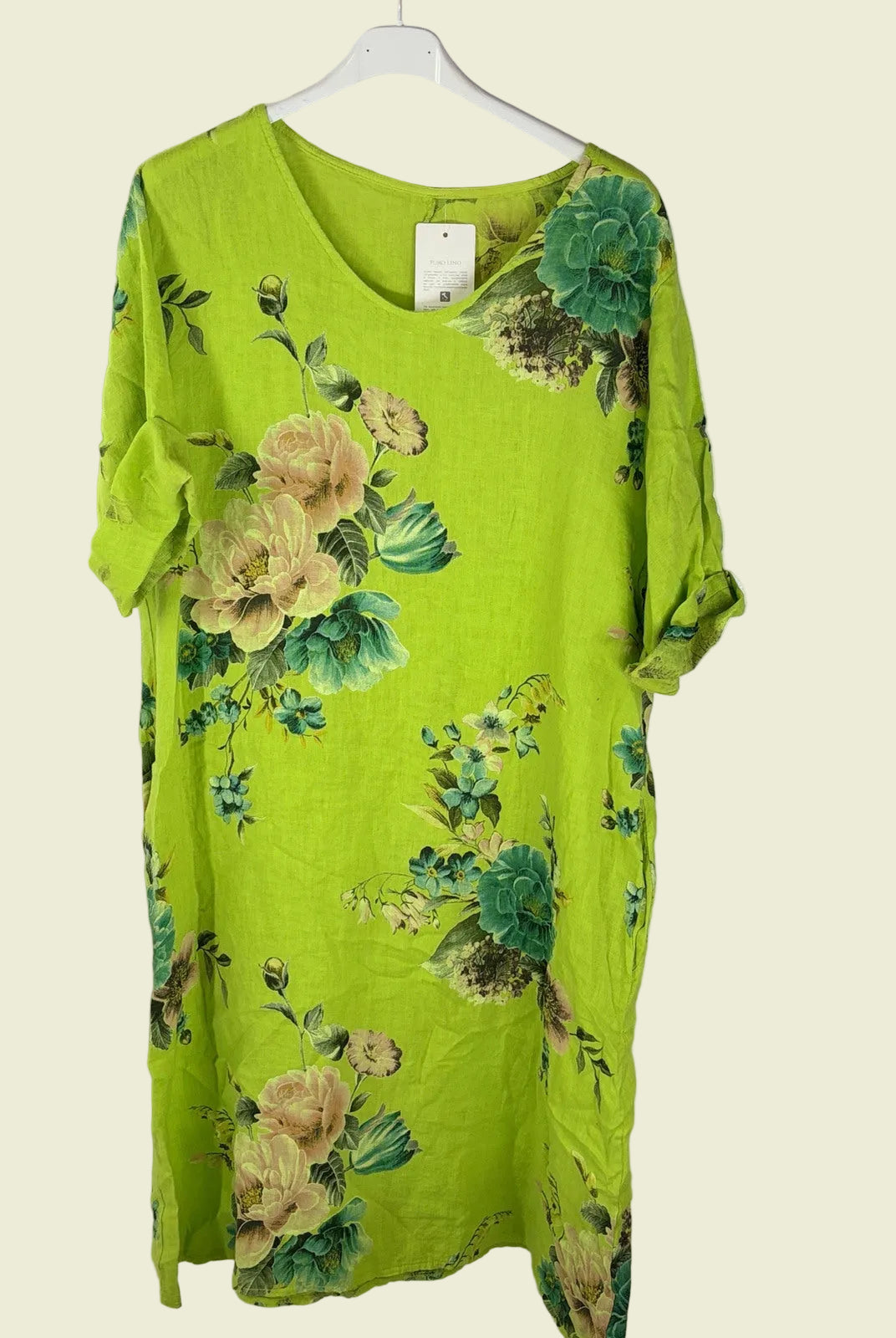 Green floral dress on a hanger