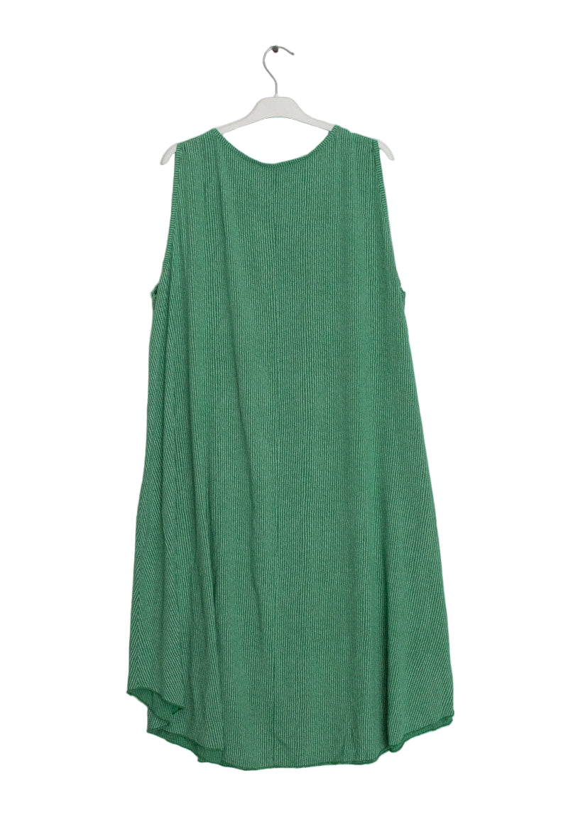 Green dress on a hanger against a white background
