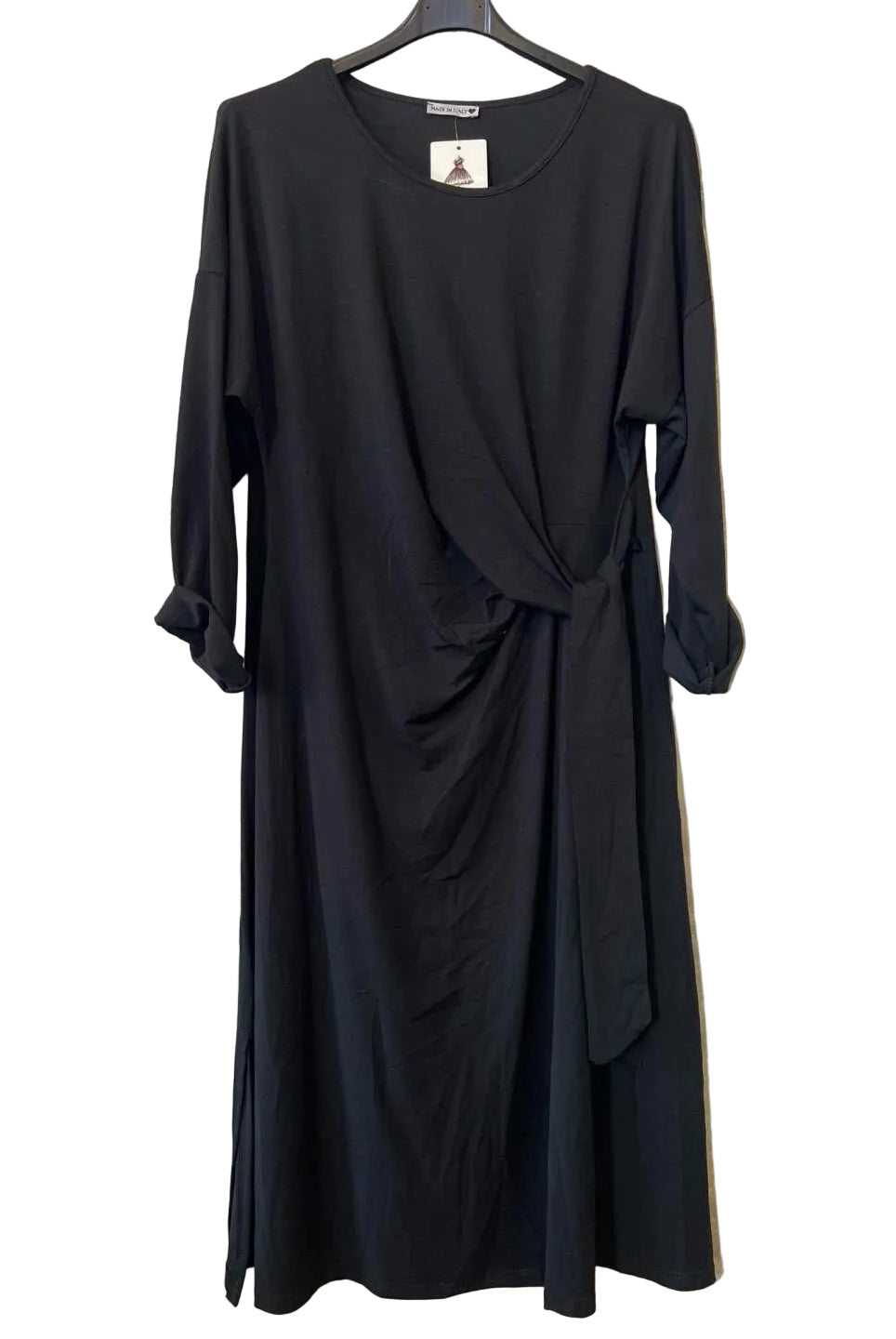 A black long-sleeve wrap-style dress with a draped front and side slit,