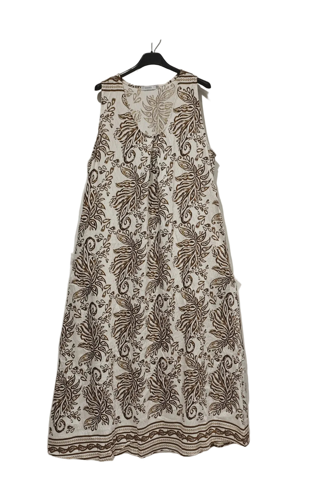 Floral patterned dress on a hanger against a plain background