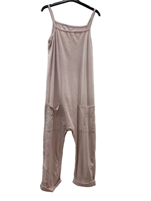 A light pink sleeveless jumpsuit with thin shoulder straps and a relaxed, harem-style leg