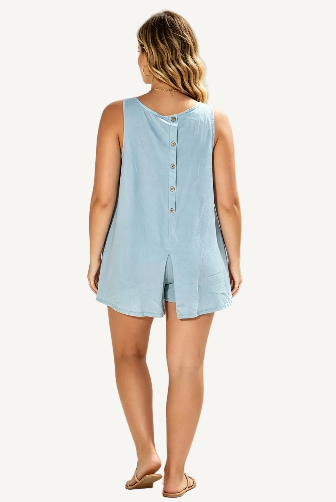Woman wearing a sky blue sleeveless top