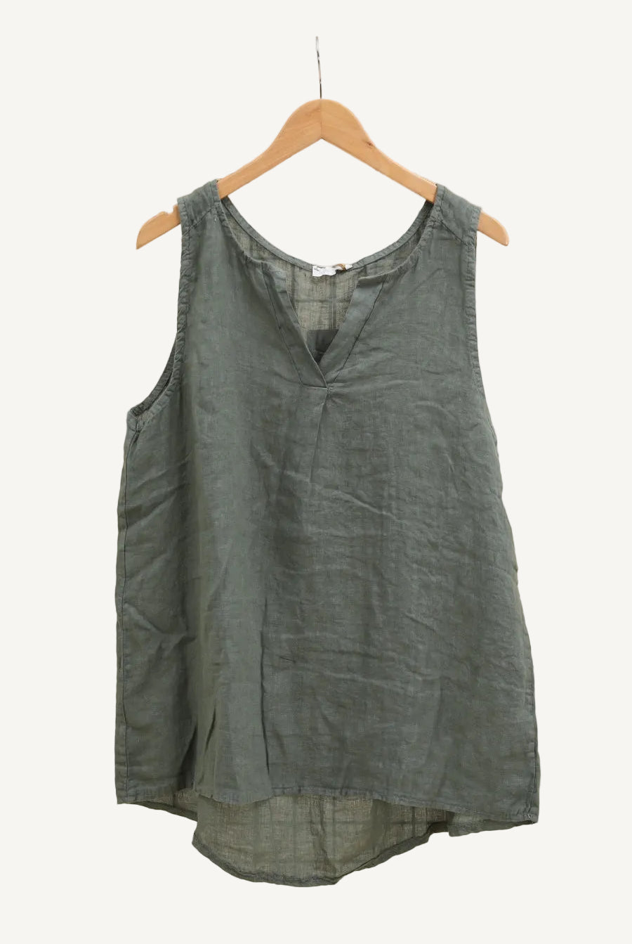 Green sleeveless top on a hanger
