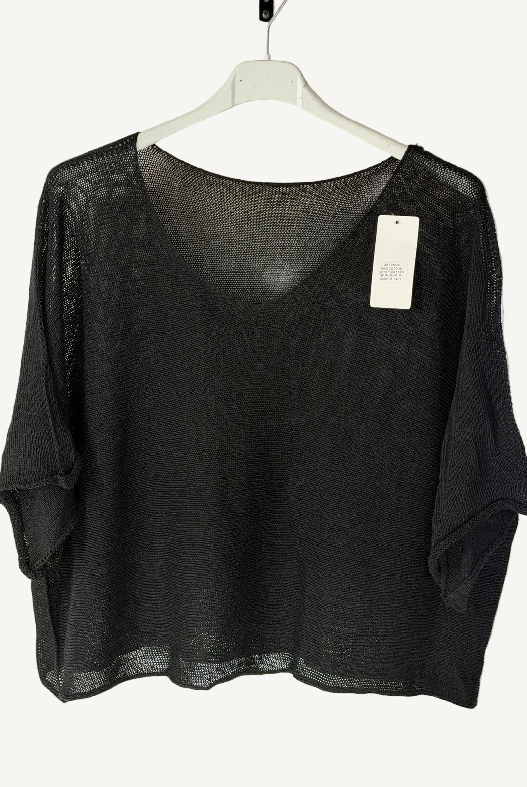 Black v neck sweater on a hanger