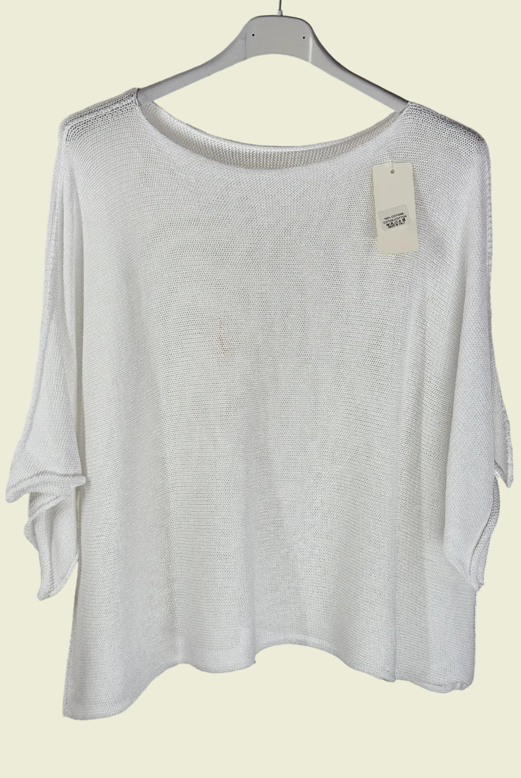 White sweater on a hanger