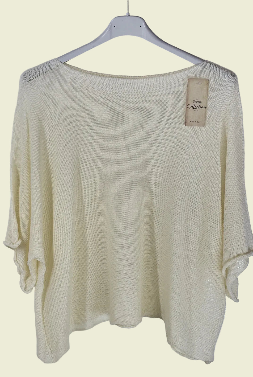 Beige sweater on a hanger