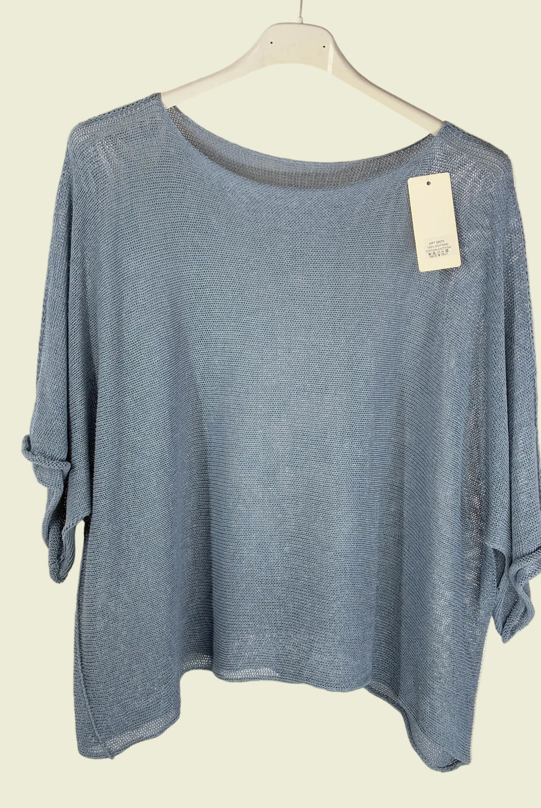 Blue sweater on a hanger