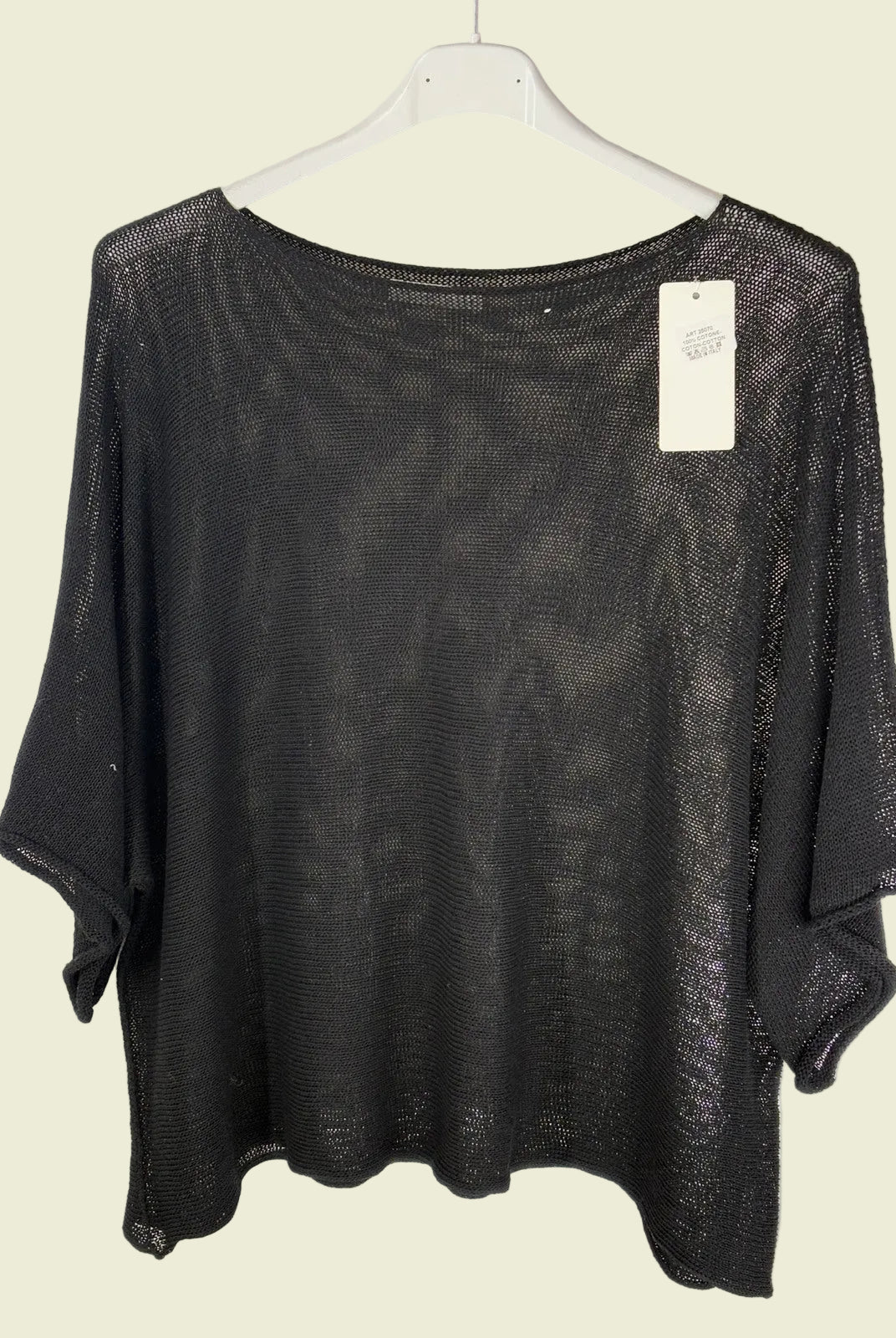 Black mesh top on a hanger
