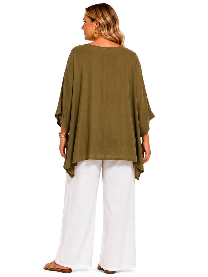 A woman shown from the back wearing an olive green draped top with wide three-quarter sleeves, paired with white wide-leg pants and brown flat sandals, against a plain white background.