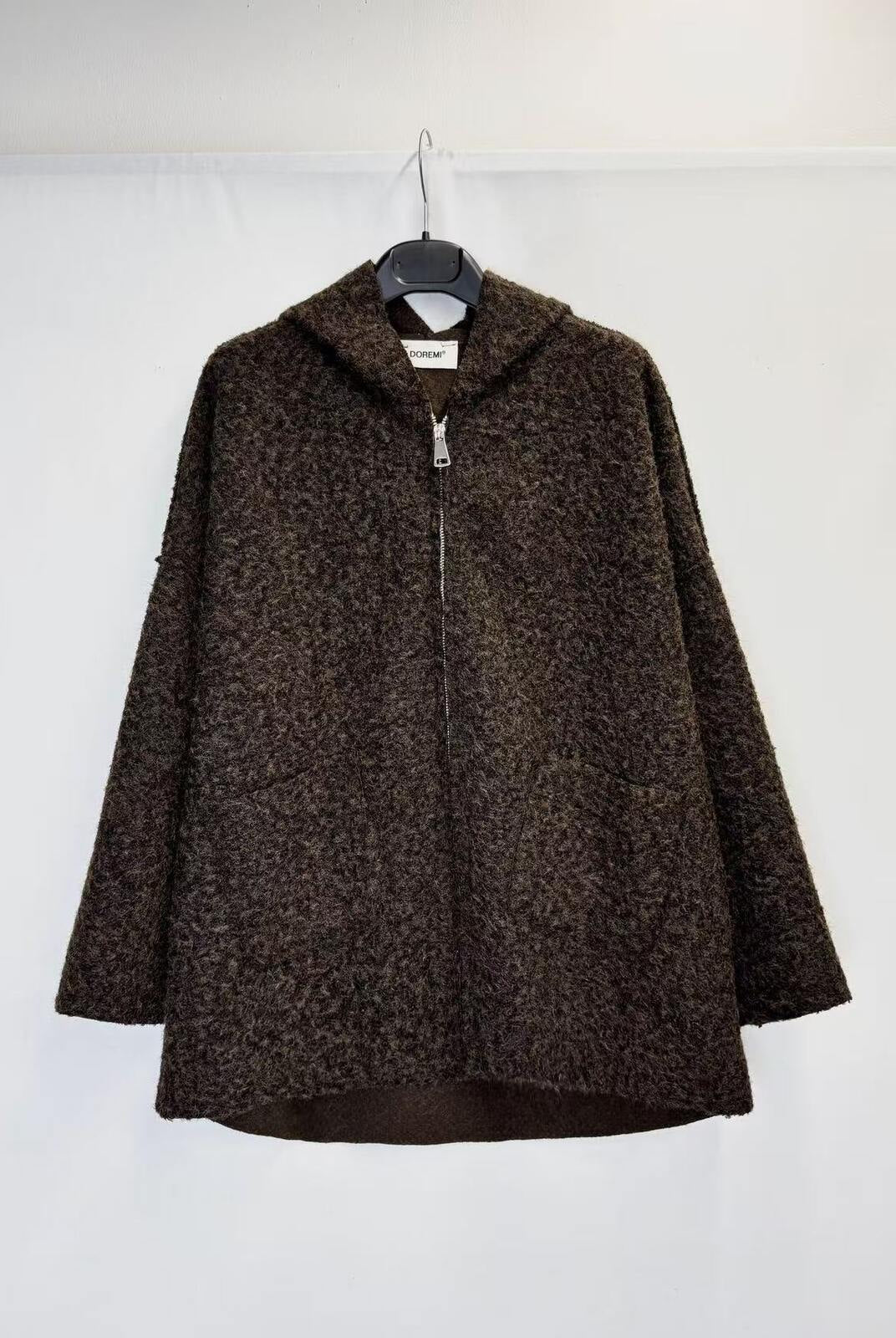 A dark brown textured zip-up jacket with a hood, hanging on a black hanger against a plain white background.