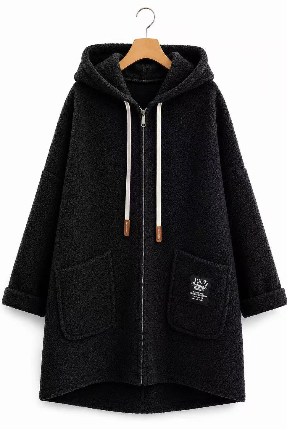 A black fleece zip-up hoodie coat with a hood, white drawstrings, and two front patch pockets, hanging on a wooden hanger against a plain white background.