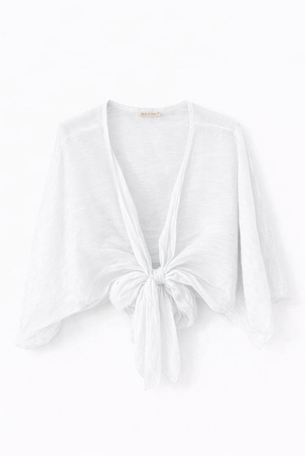 White bolero top with a knot detail on a white background