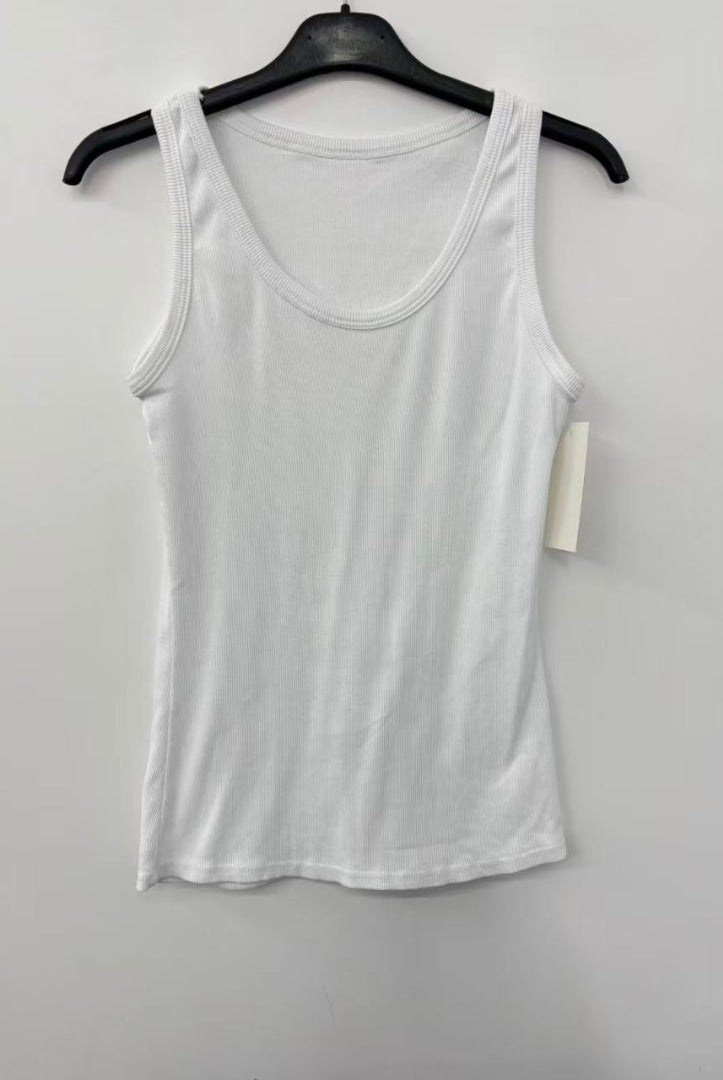 White tank top on a hanger against a white background