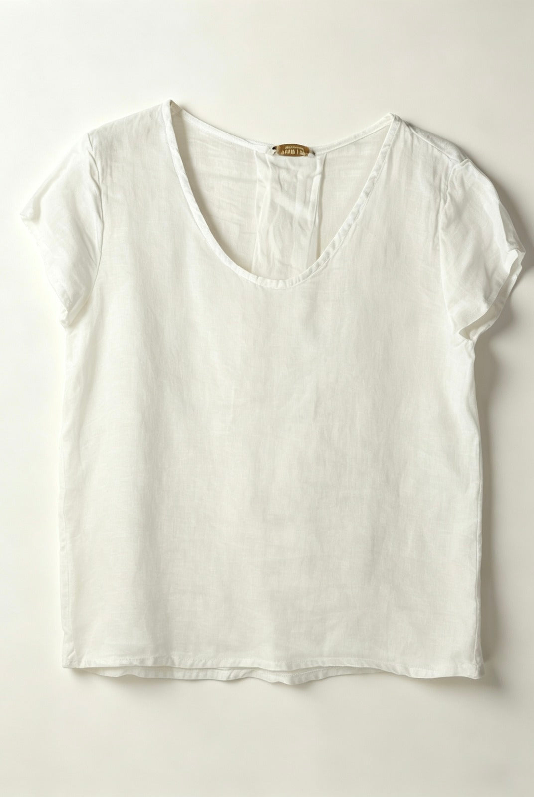 White t-shirt on a light gray background