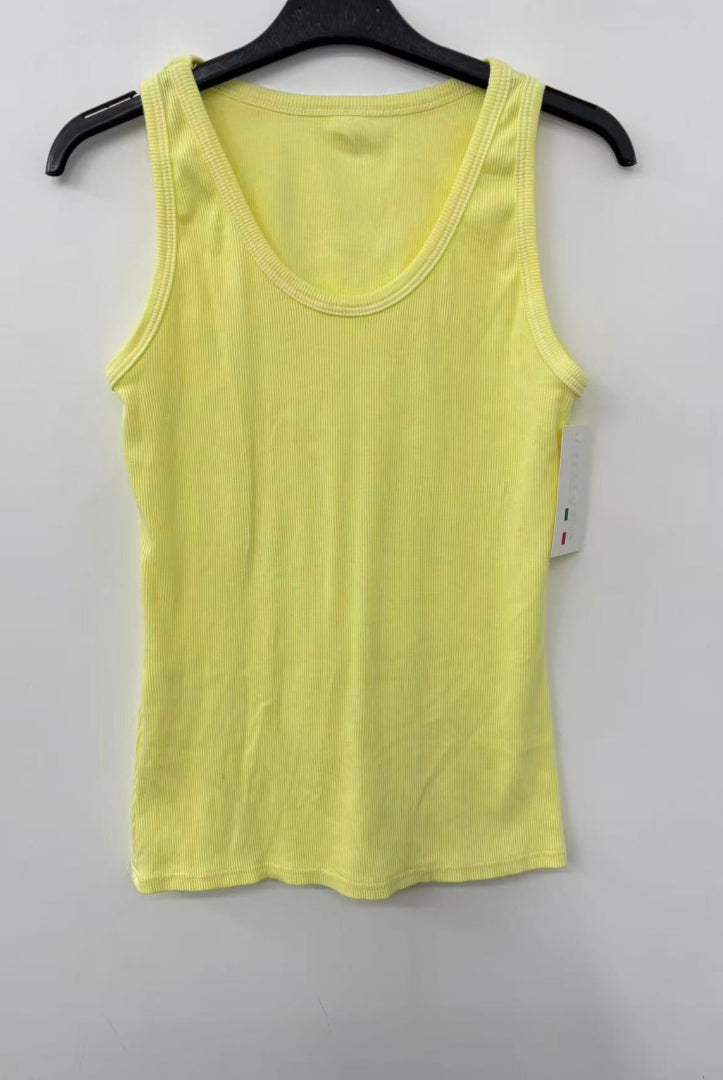 Yellow tank top on a hanger against a white background