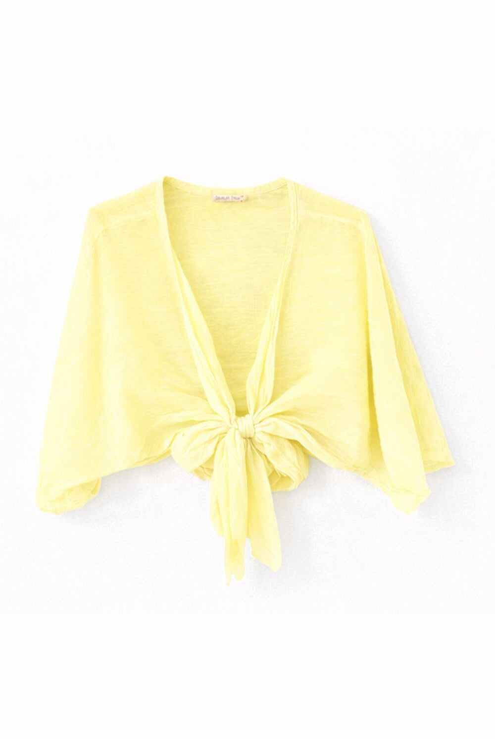 Yellow cardigan with a knot detail on a white background