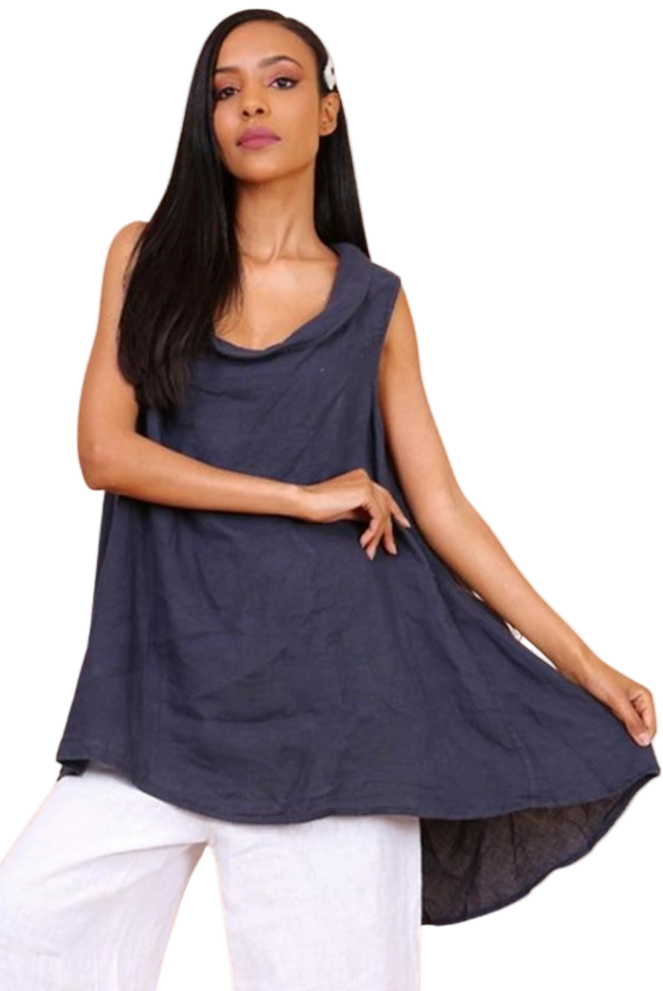 A woman wearing a navy blue sleeveless cowl neck top with an asymmetrical hem, paired with white trousers.