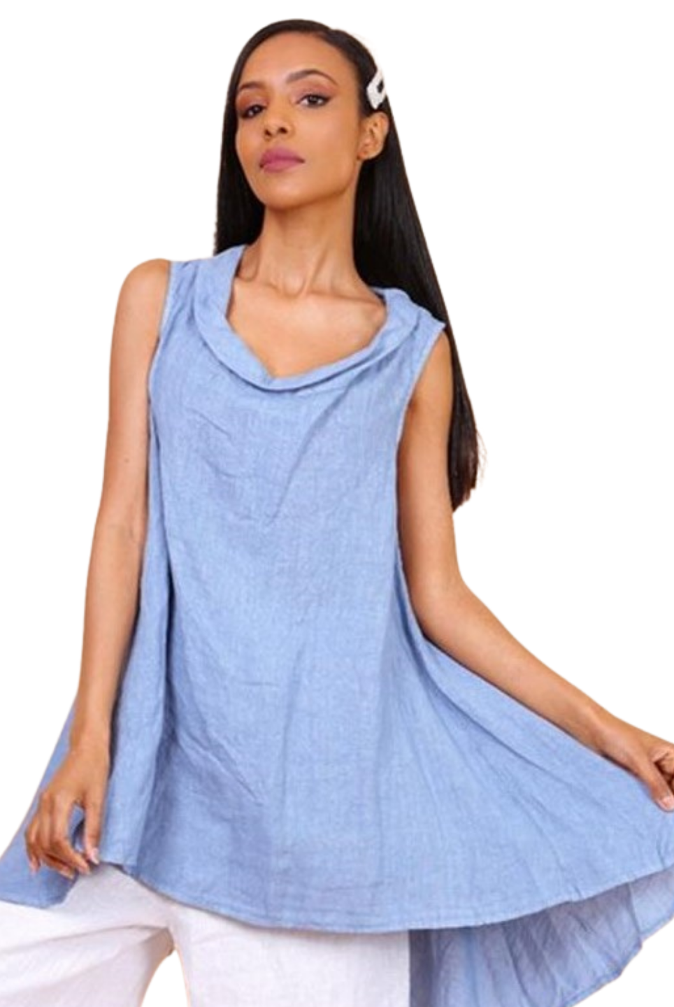 A woman wearing a sky blue sleeveless cowl neck top with an asymmetrical hem, paired with white trousers.