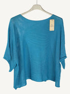 Blue sweater on a hanger with a white background
