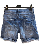 Blue denim shorts on a hanger 