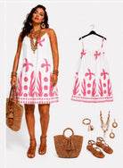 Woman wearing a white dress with pink floral patterns,