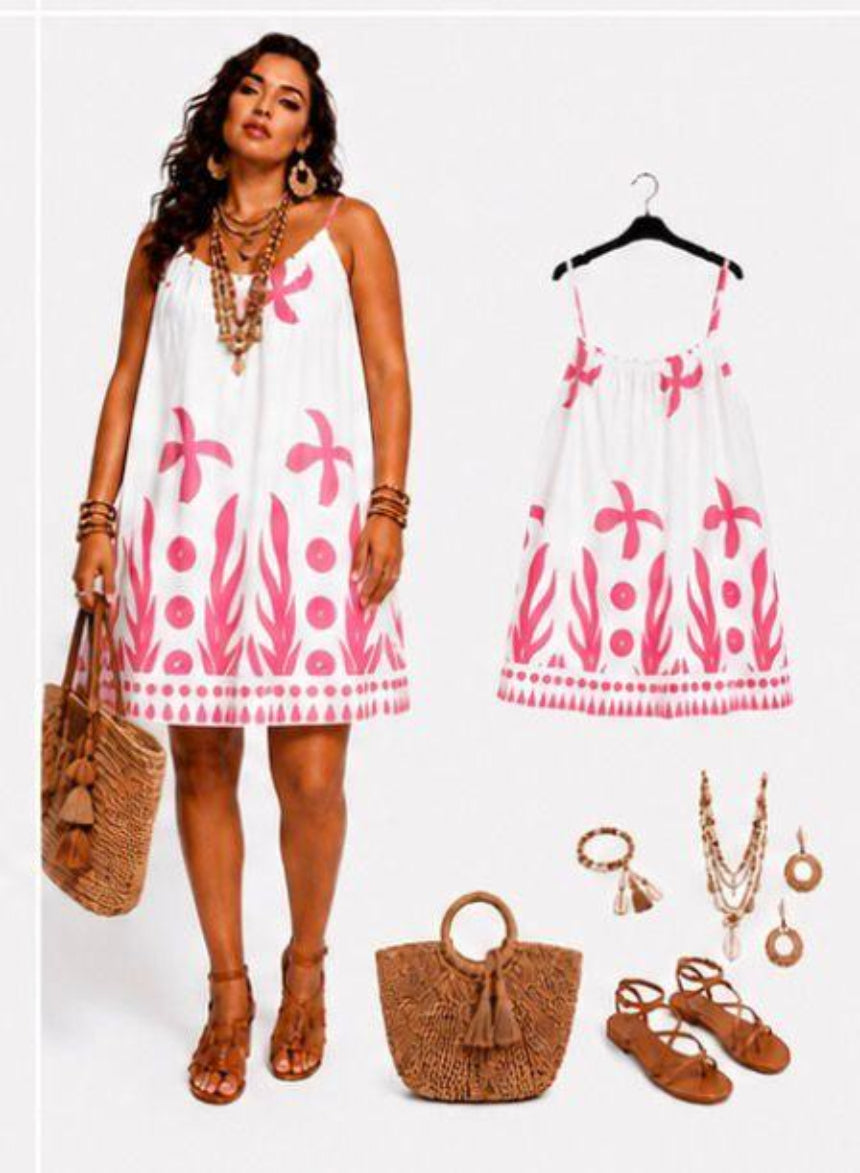 Woman wearing a white dress with pink floral patterns,