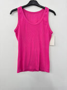 A bright pink sleeveless tank top hanging on a black hanger