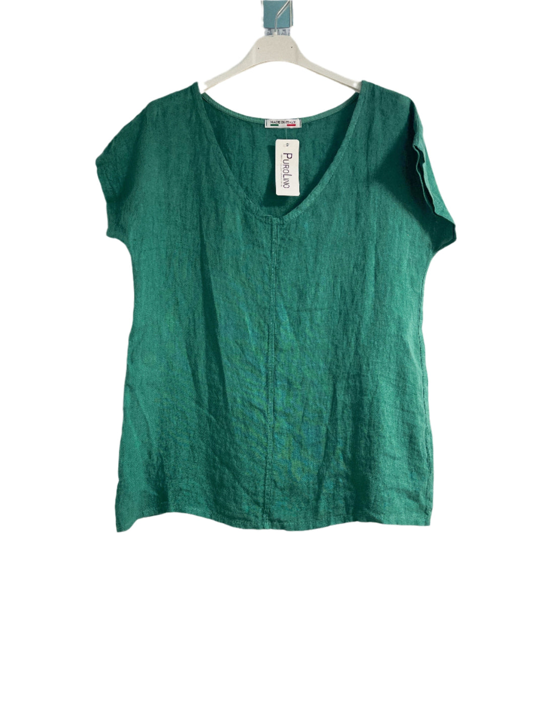 Green sleeveless top on a hanger with a white background